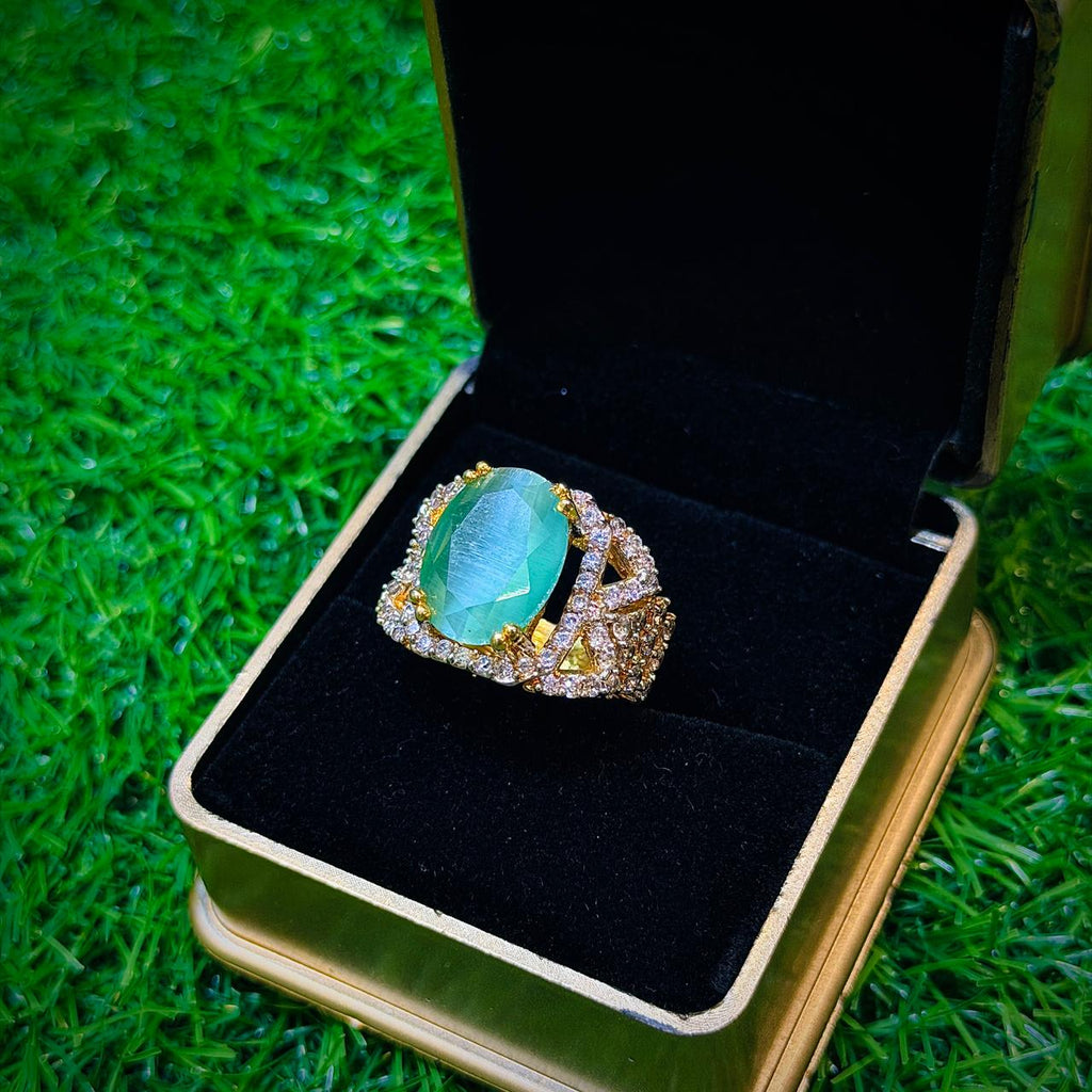 Gold plated ring with mint colour stone