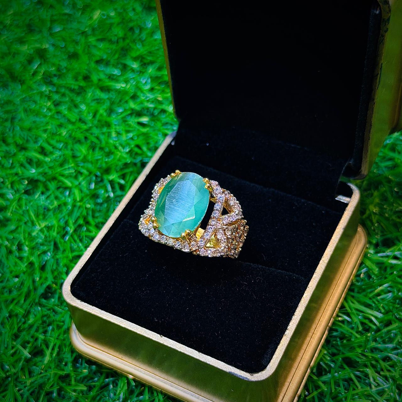 Gold plated ring with mint colour stone