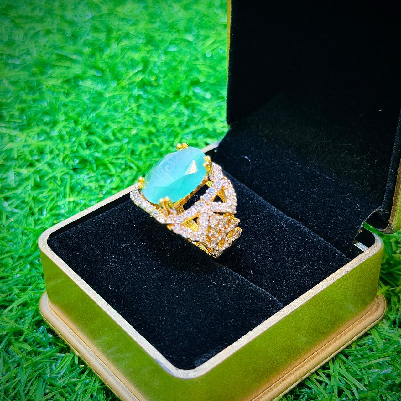 Gold plated ring with mint colour stone