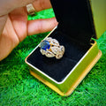 Gold plated ring with navy stone