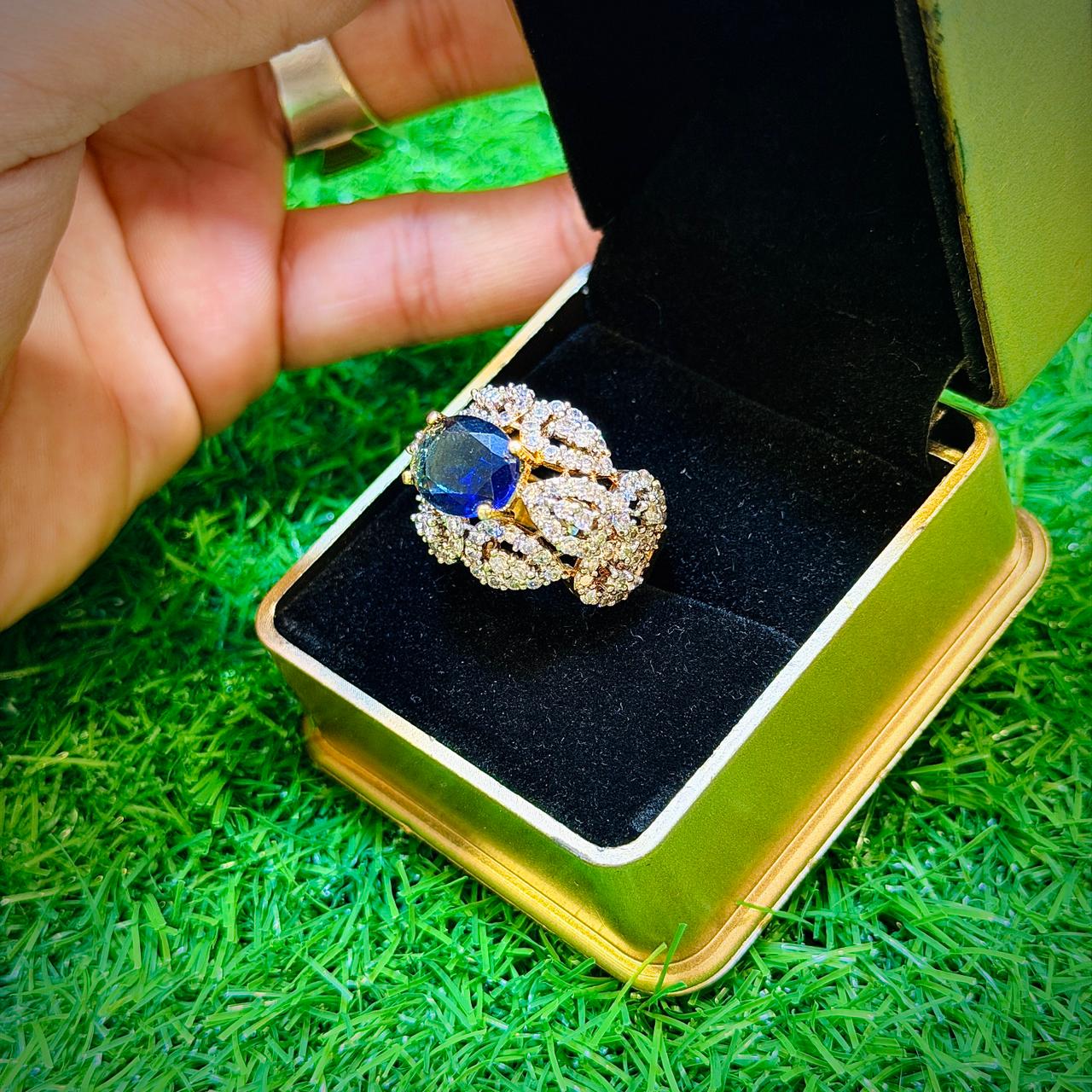 Gold plated ring with navy stone