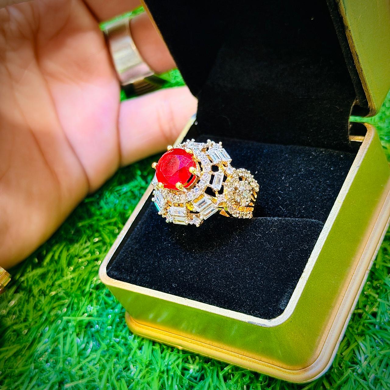 Gold plated ring with red stone