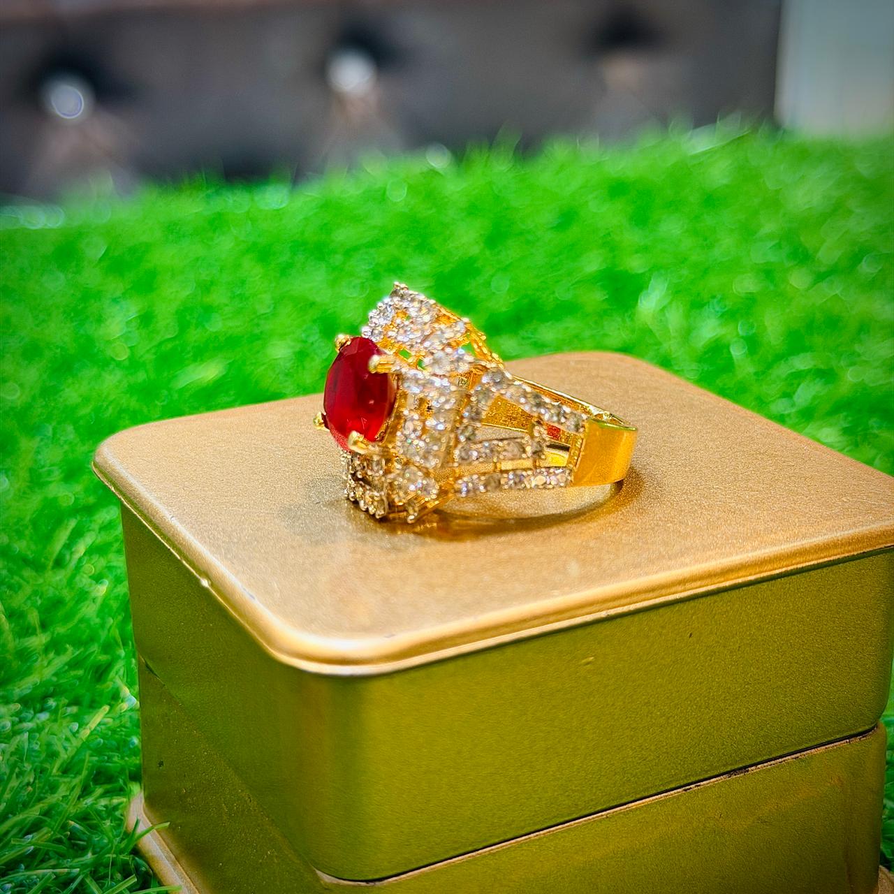 Gold plated ring with red stone