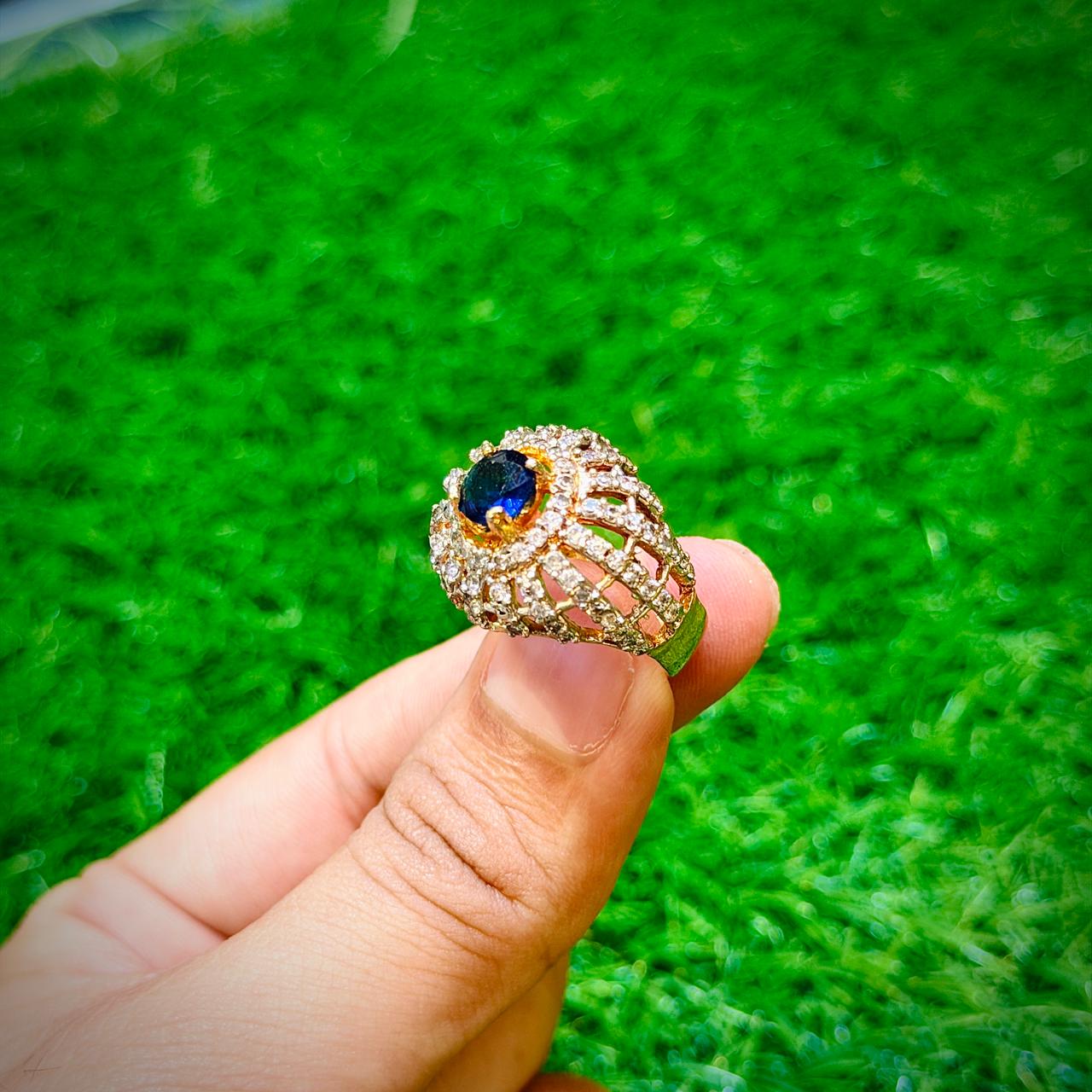 Gold plated ring with dark blue stone