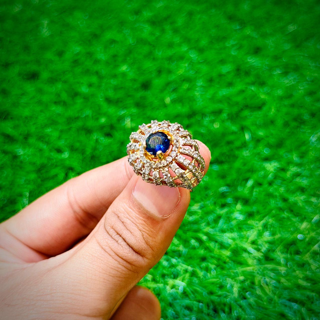 Gold plated ring with dark blue stone
