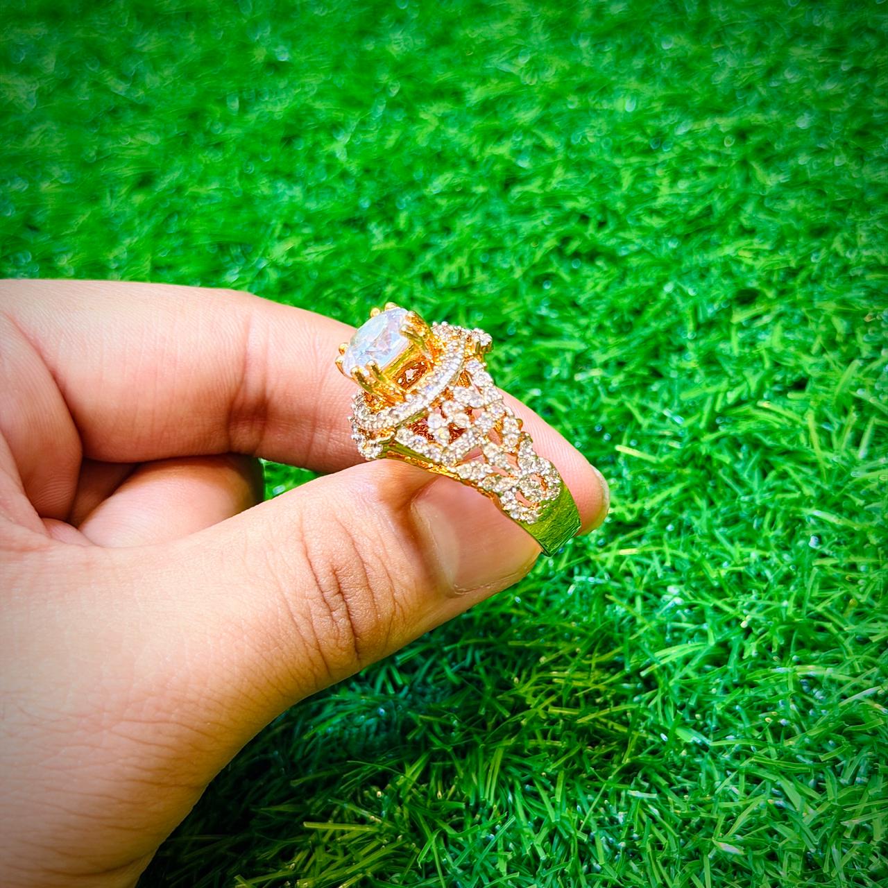 Gold plated ring with white stone