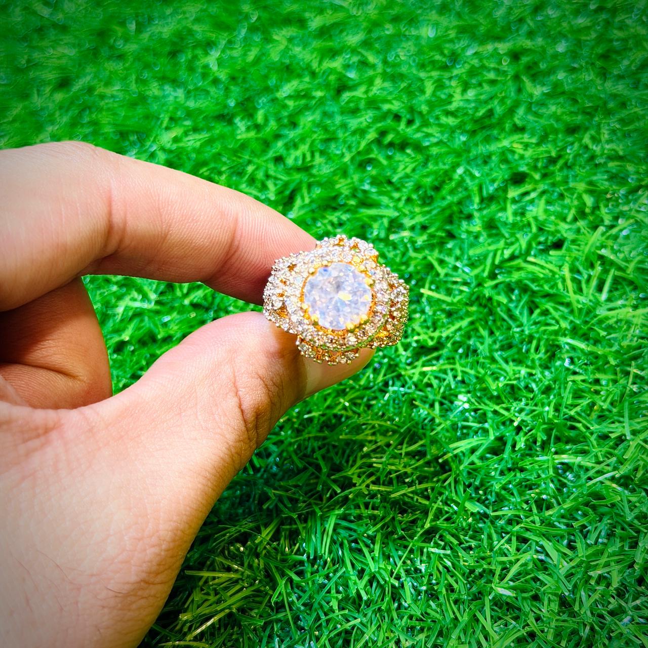 Gold plated ring with white stone