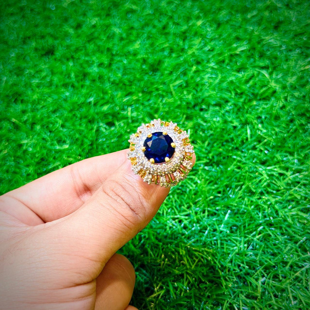 Gold plated ring with dark blue stone
