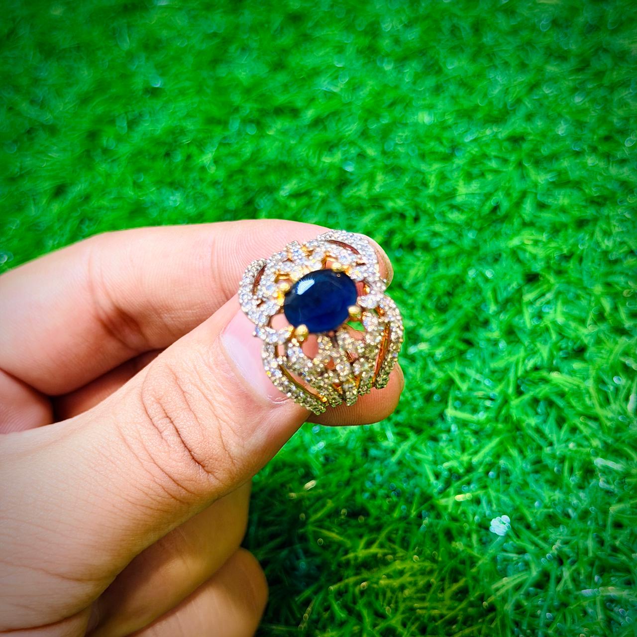Gold plated ring with dark blue stone, unique design