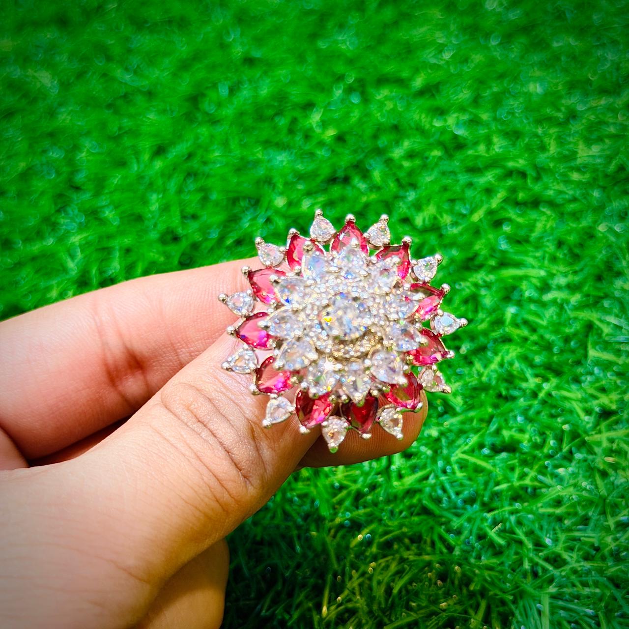 Gold plated ring with flower design & shocking pink stone