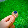 Gold plated ring with dark blue stone