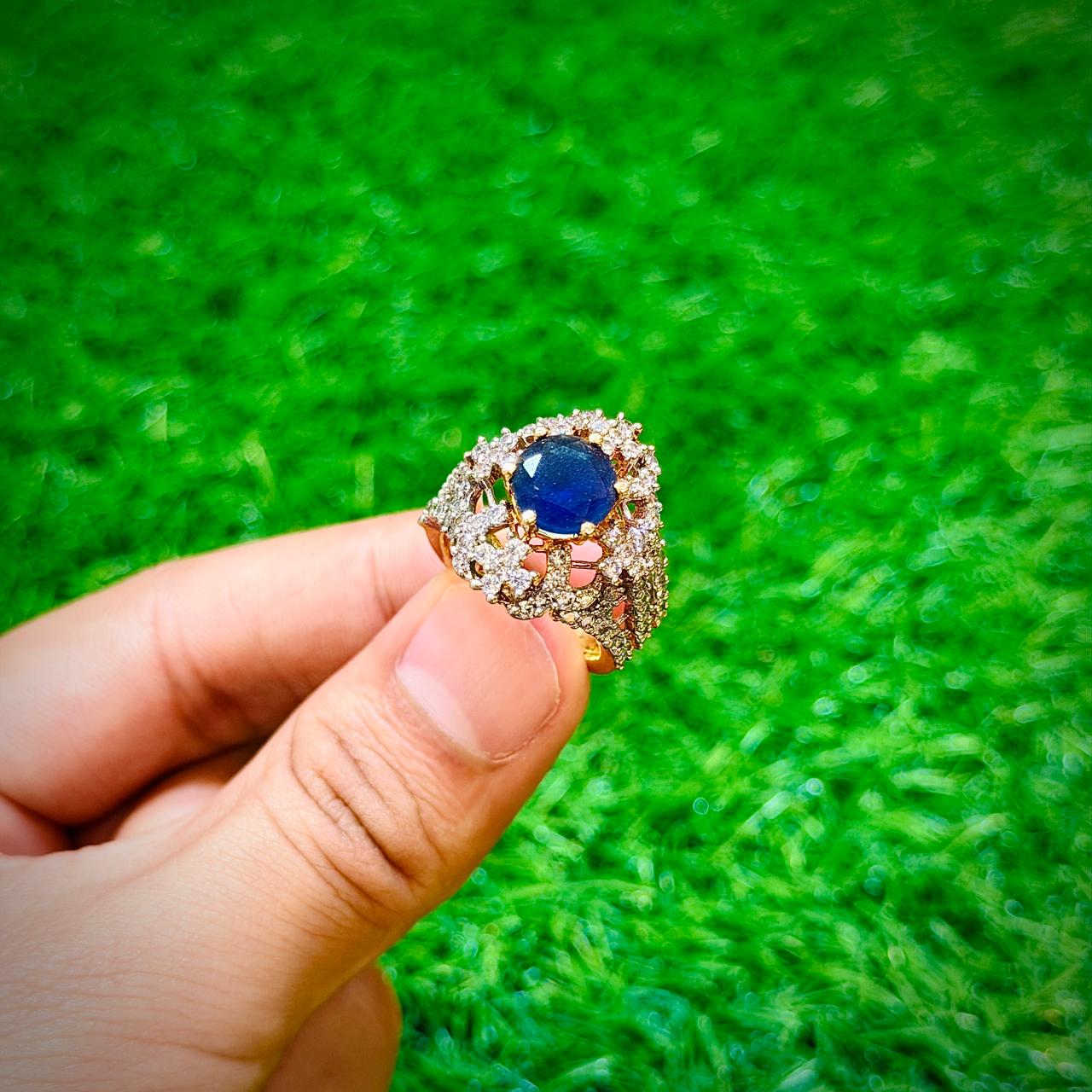 Gold plated ring with dark blue stone