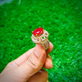 Gold plated ring with ruby red stone