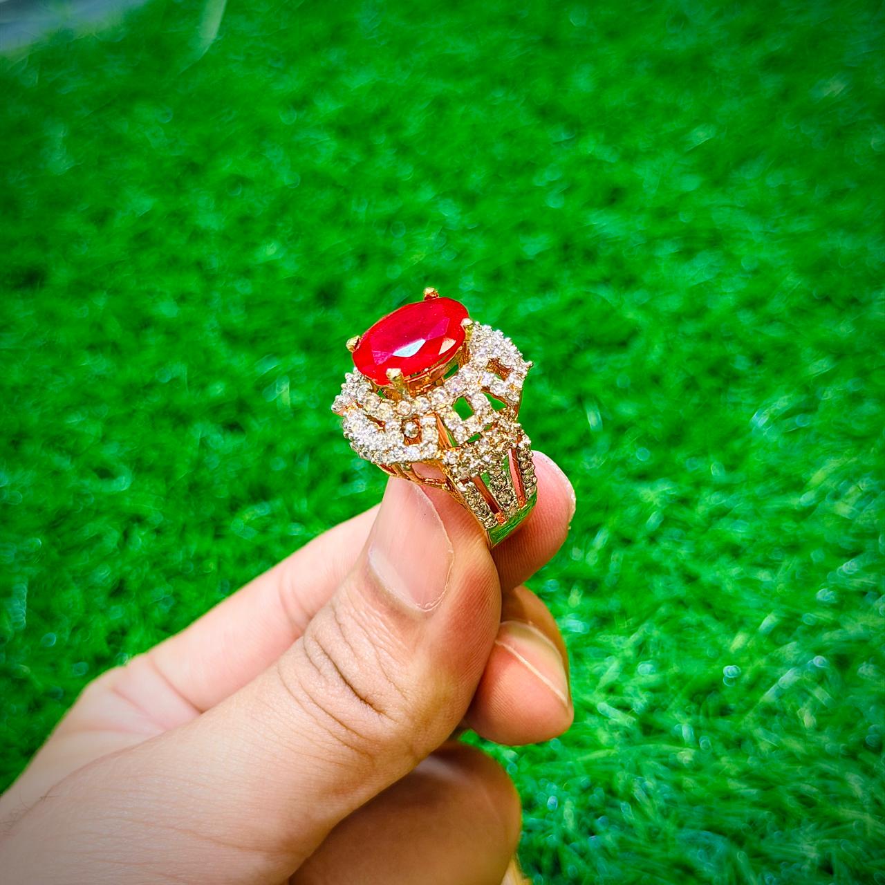Gold plated ring with ruby red stone