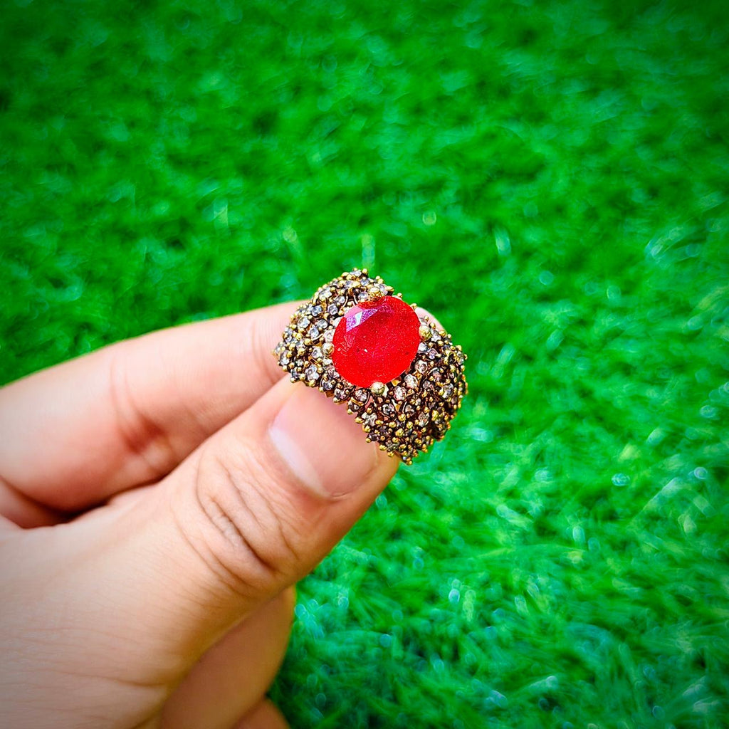 Gold plated ring with ruby red stone