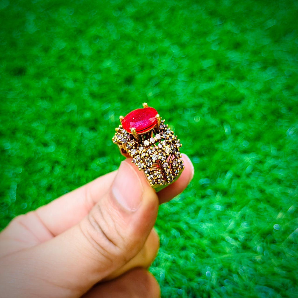 Gold plated ring with ruby red stone