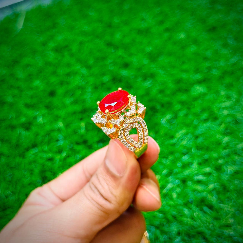 Gold plated ring with ruby red stone
