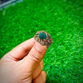 Gold plated ring with forest green stone