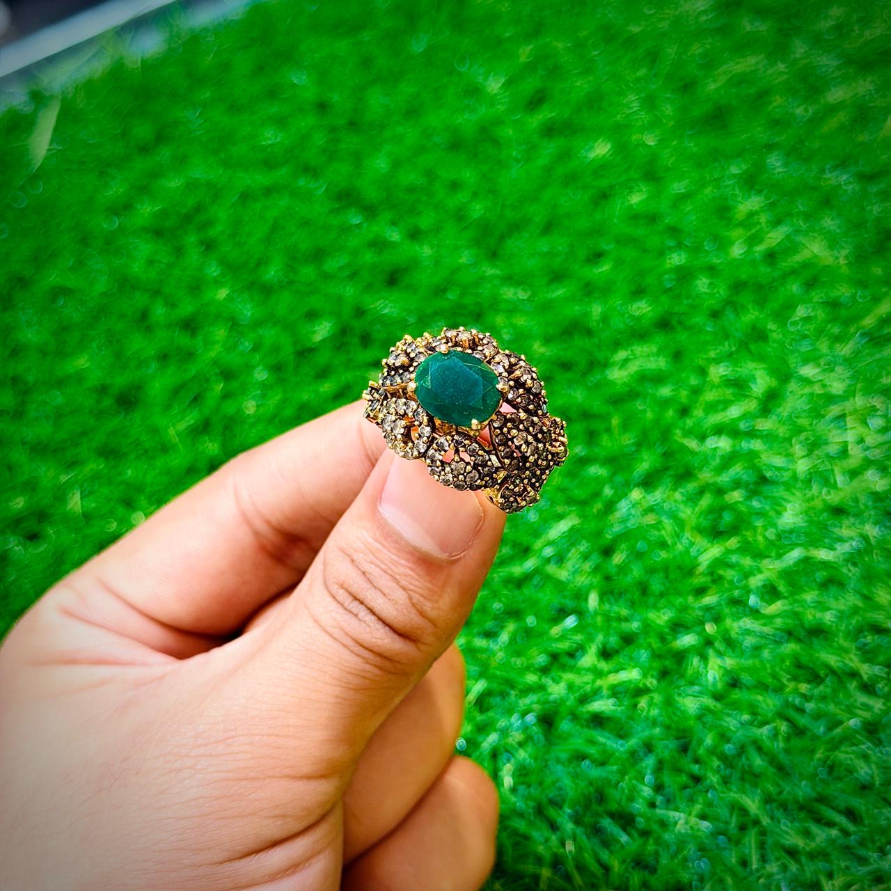 Gold plated ring with forest green stone