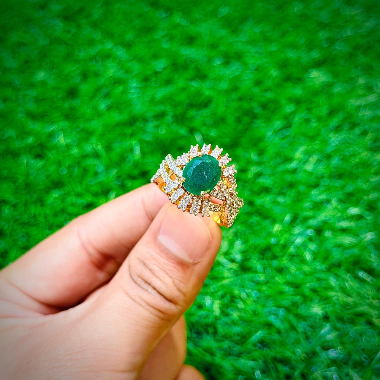 Gold plated ring with emerald green stone