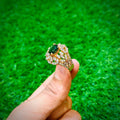 Gold plated ring with emerald green stone