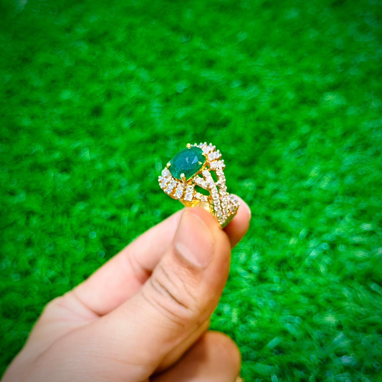 Gold plated ring with emerald green stone