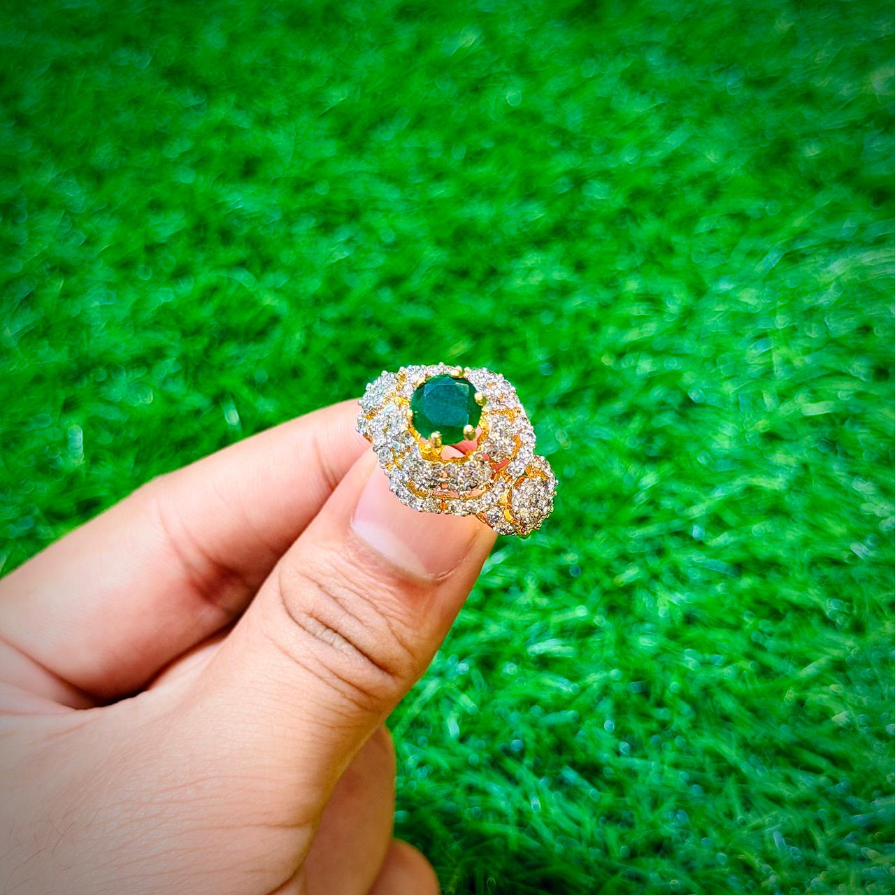 Gold plated ring with emerald green stone