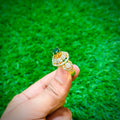 Gold plated ring with small emerald green stone