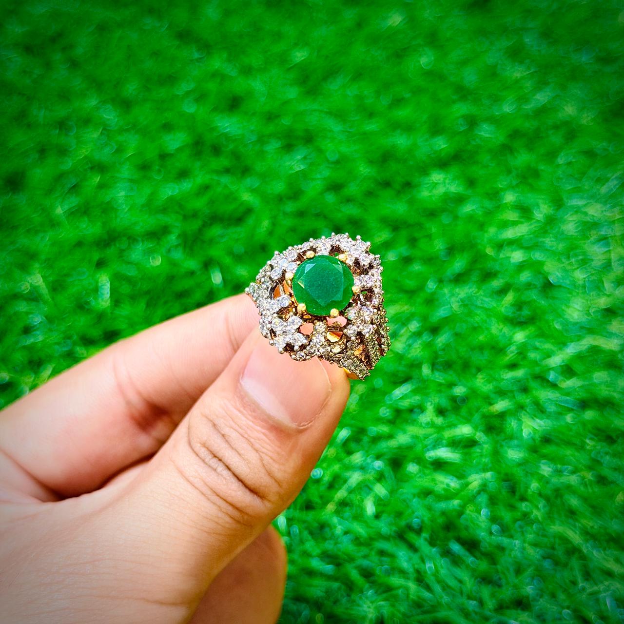 Gold plated ring with emerald green stone