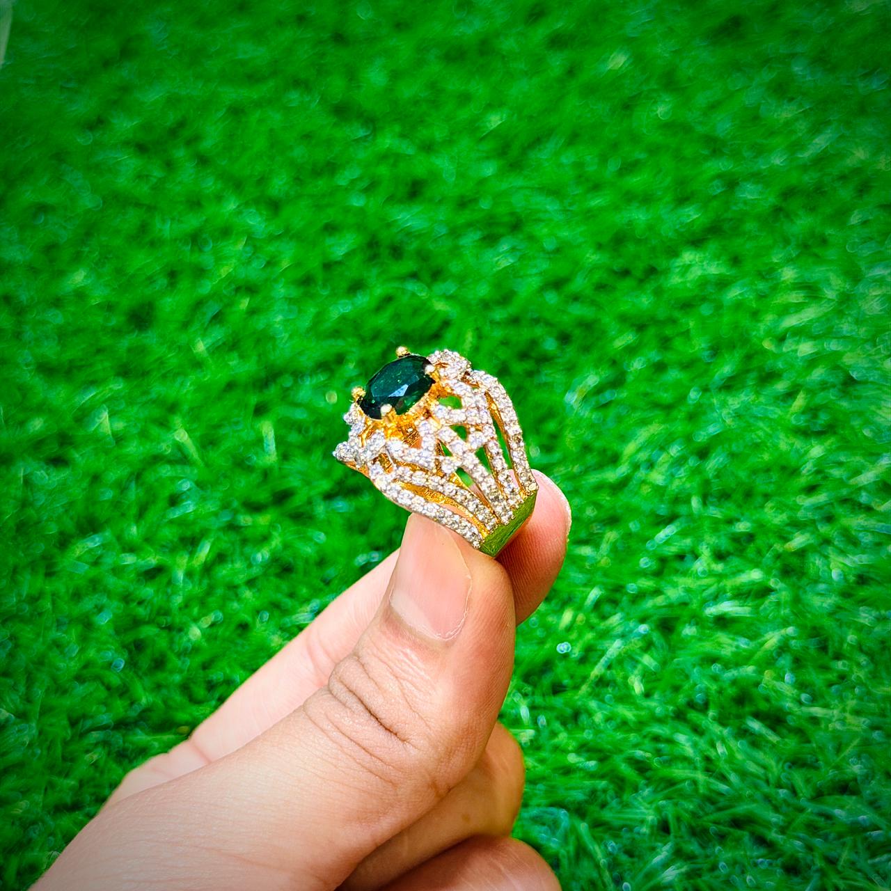 Gold plated ring with dark green stone