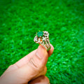 Gold plated ring with emerald green stone