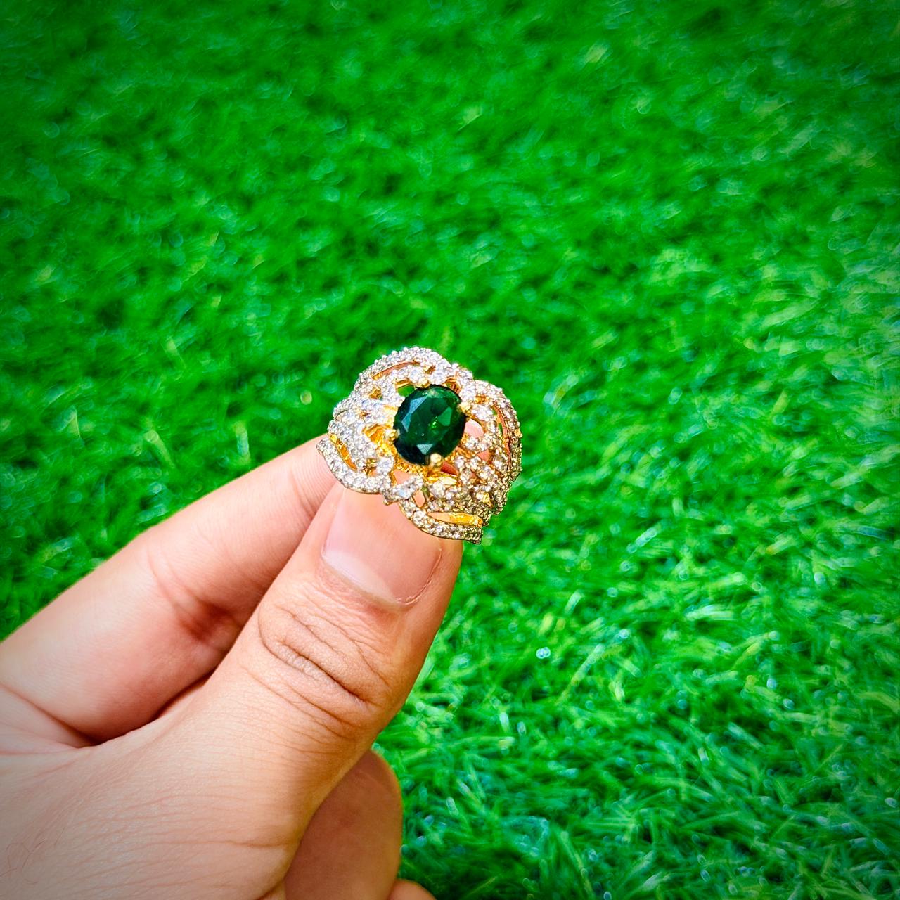 Gold plated ring with emerald green stone