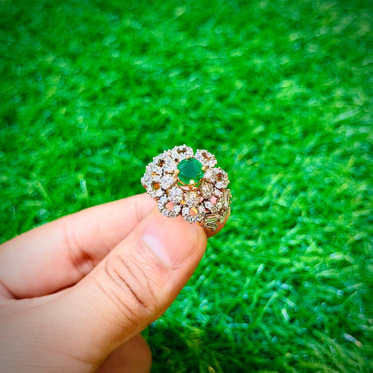 Gold plated ring with emerald green stone