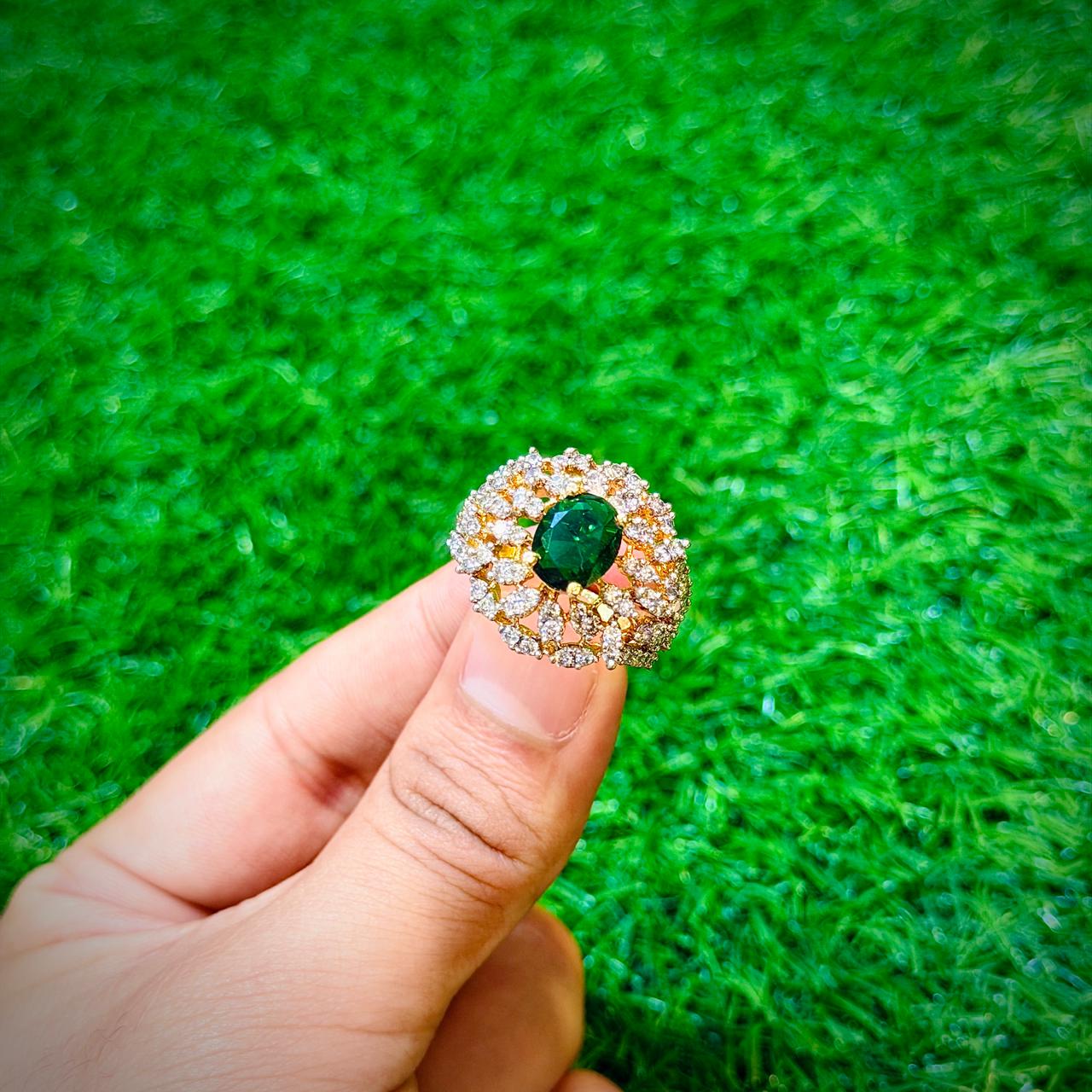 Gold plated ring with emerald green stone