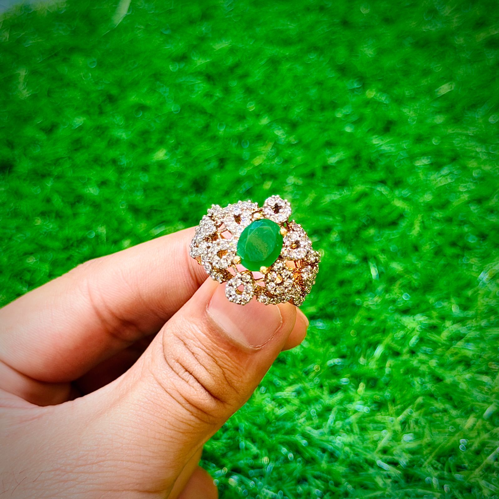 Gold plated ring with emerald green stone
